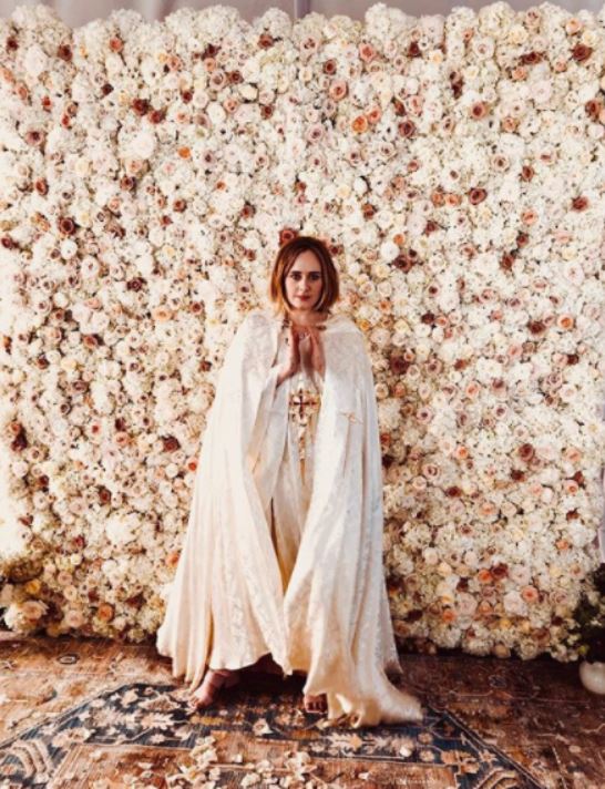 Adele in a white gown during her best mate's wedding