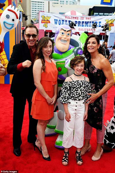 Katherine Allen is all smiling alongside his father, stepmother, and stepsister in a rare family outing for Toy Story 4